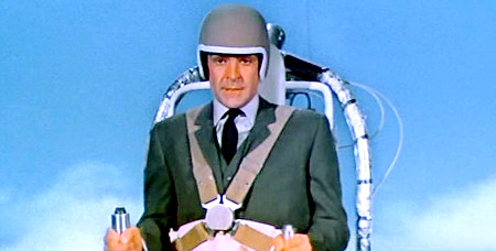 Original Filename: TB_Bell_Textron_Jet_Pack.jpg "No well dressed man should be without one" comments James Bond after he escapes from Jacques Boitiers château during the fast paced pre-title sequence. Pursued by Boitiers men, Bond straps the jetpack on and soars over the walls to the safety of his Aston Martin DB5 waiting outside. Able to carry its occupant up to 600 feet and remaining airborne for up to 4 minutes, this is truly a Bondian style gadget.